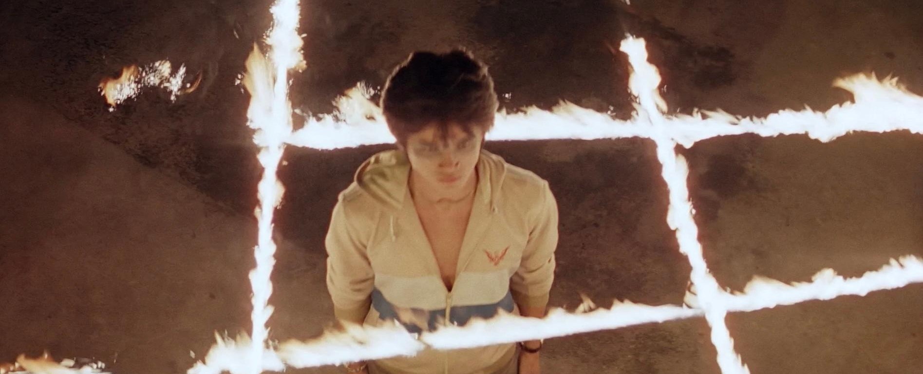devil fetus header - a young nam stands in the center of a grid of fire