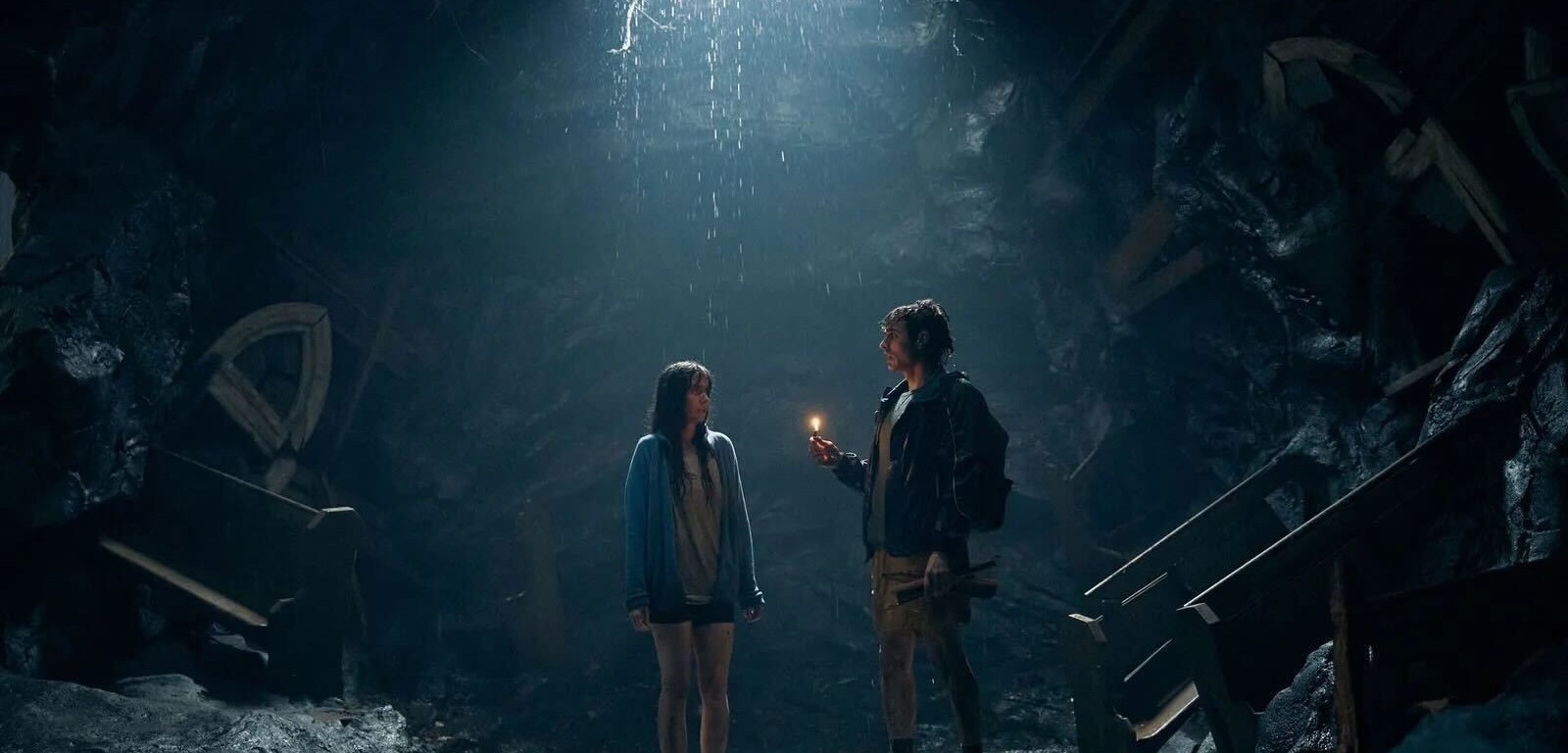 image from the film Together: alison brie and dave franco trapped in a hole, the opening casting light down on them