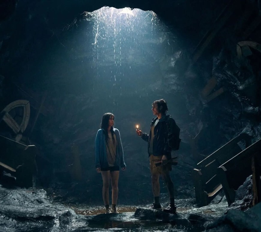image from the film Together: alison brie and dave franco trapped in a hole, the opening casting light down on them