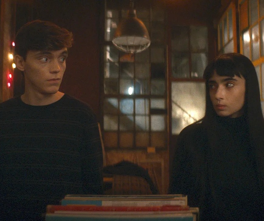 humanist vampire header - a boy and a girl looking at each other as a record plays. the girl is a vampire