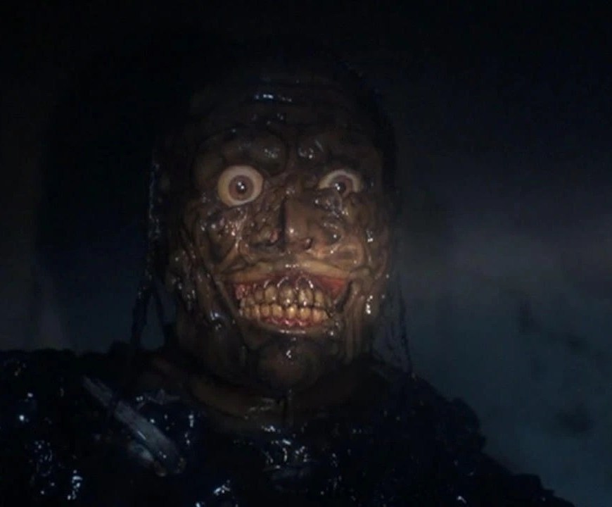 a close up of a zombie face